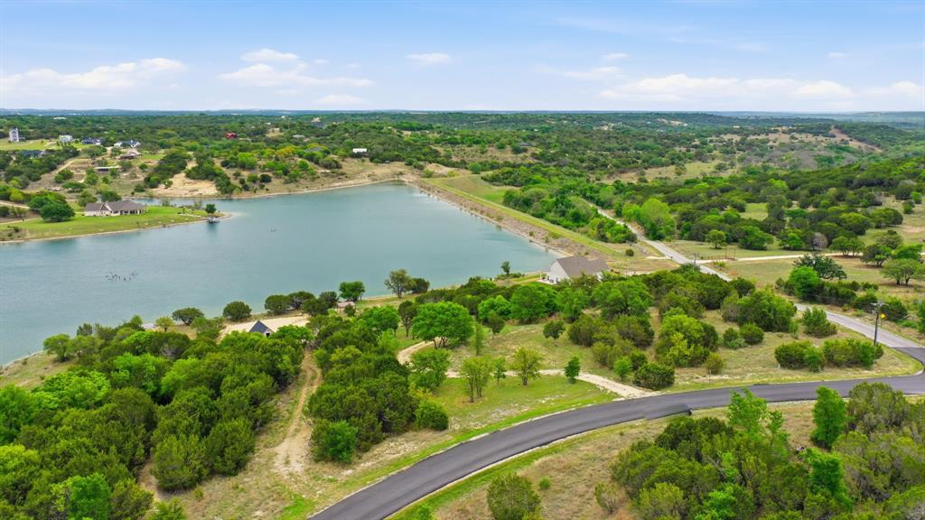 305 Compass Way Bluff Dale Bluff Dale, TX 76433 - Photo 12 of 25 a view of a lake with a city