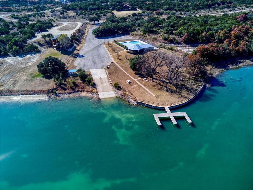 305 Compass Way Bluff Dale Bluff Dale, TX 76433 - Photo 22 of 25 an aerial view of a house with a garden and swimming pool