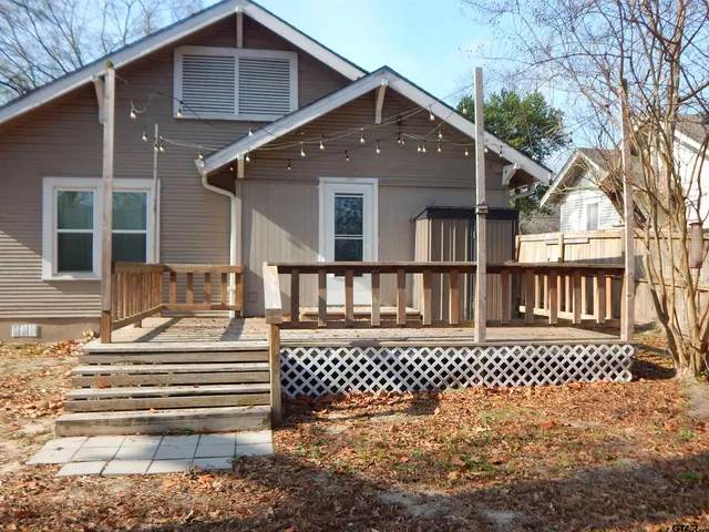 a front view of a house with a large window