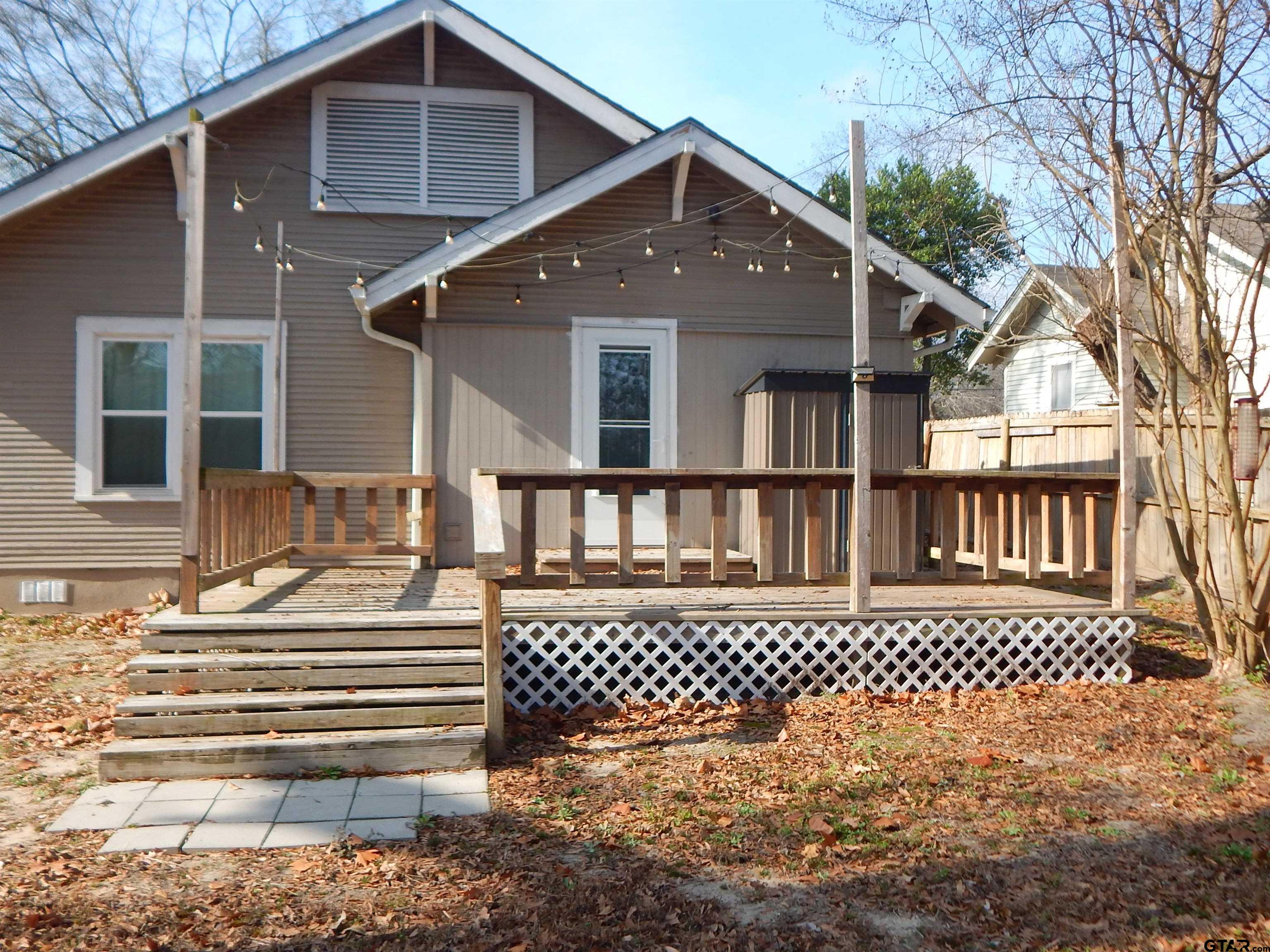 507 North Trinity Street Gilmer, TX 75644 - Photo 12 of 45 a front view of a house with a large window
