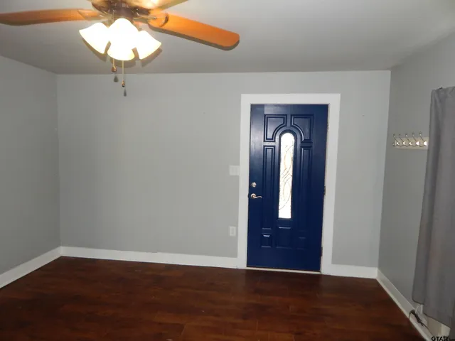a view of entryway with wooden floor