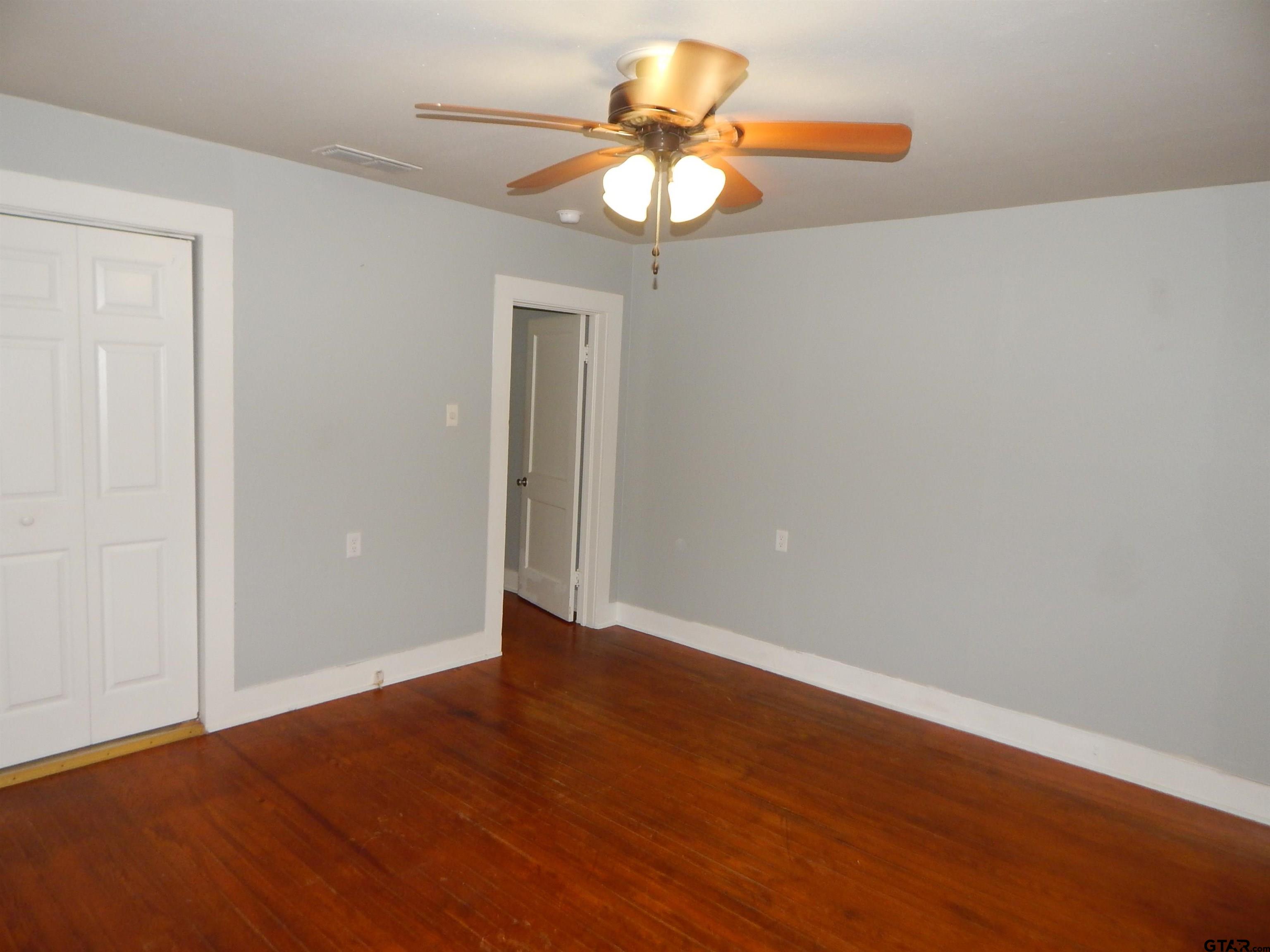 507 North Trinity Street Gilmer, TX 75644 - Photo 40 of 45 a view of an empty room with a window