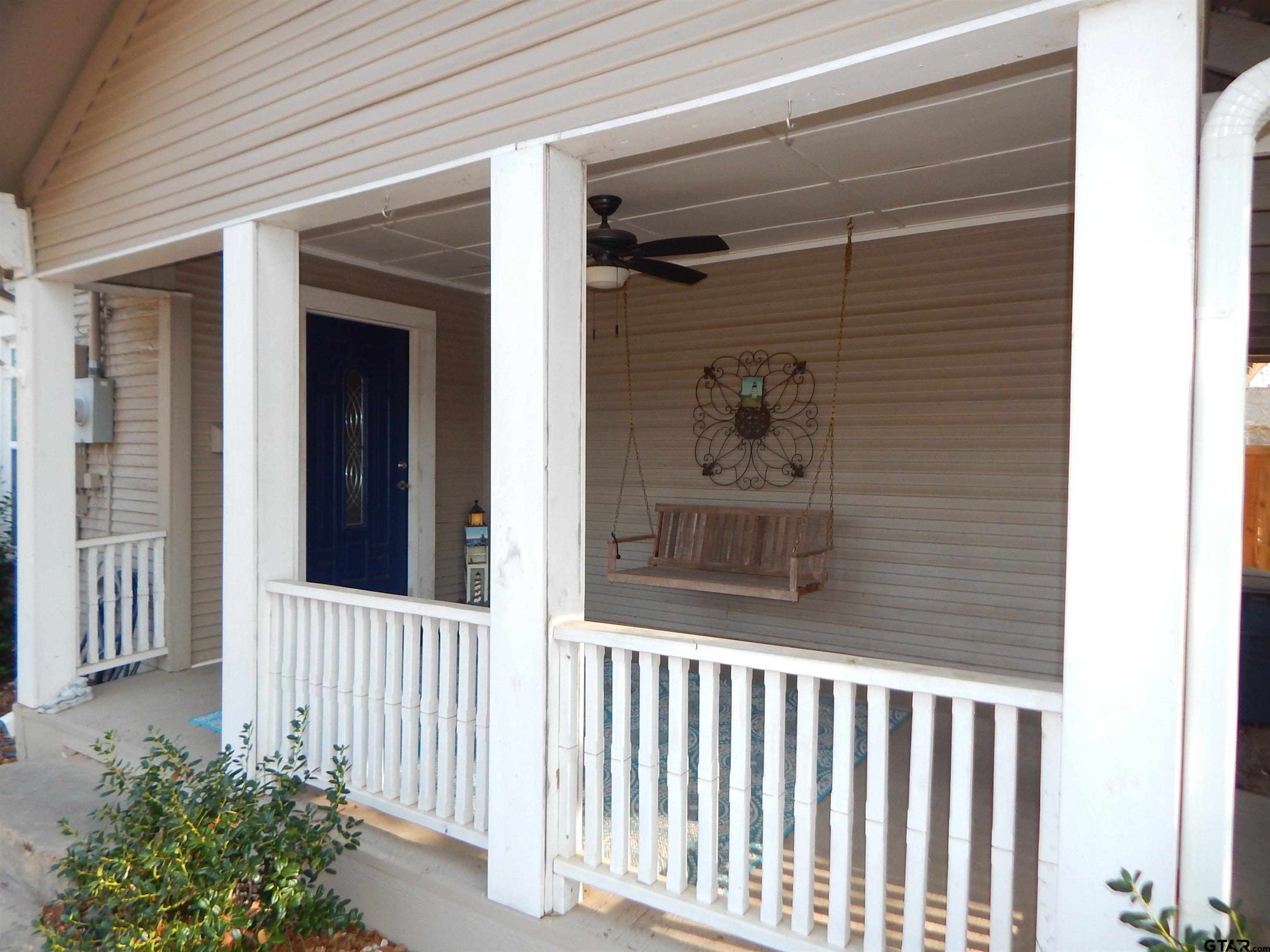 507 North Trinity Street Gilmer, TX 75644 - Photo 5 of 45 a view of a porch