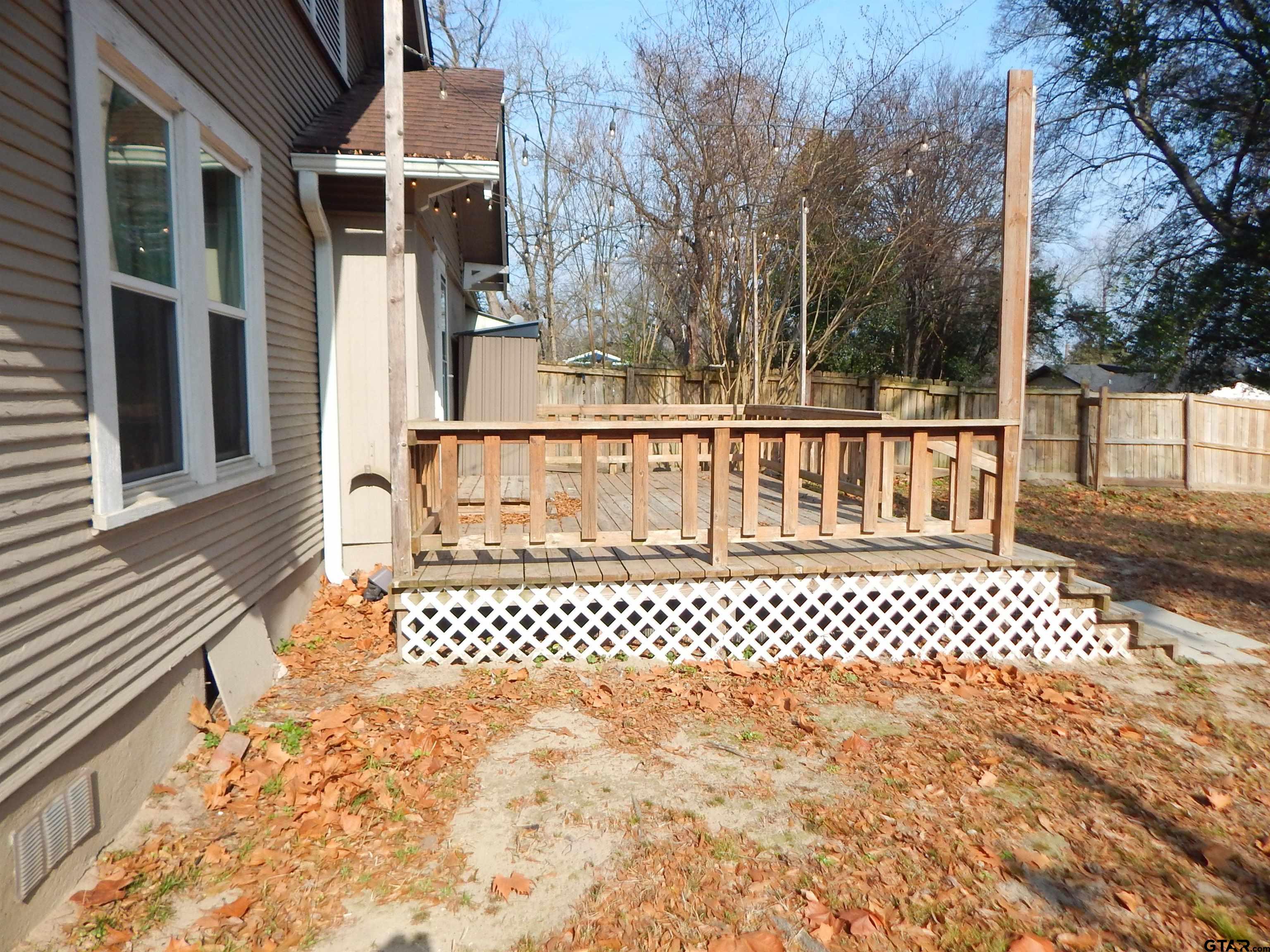 507 North Trinity Street Gilmer, TX 75644 - Photo 9 of 45 a view of a white building on the side of a building