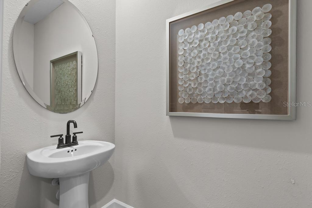 60 Pegasus Road Flagler Beach, FL 32136 - Photo 16 of 51 a bathroom with a sink a mirror and vanity
