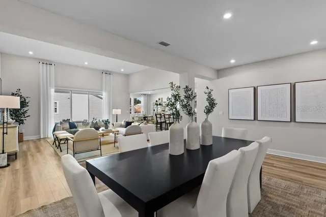 a living room with fireplace furniture and a table