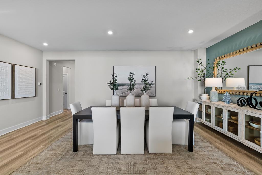 60 Pegasus Road Flagler Beach, FL 32136 - Photo 21 of 51 a living room with furniture a table and wooden floor