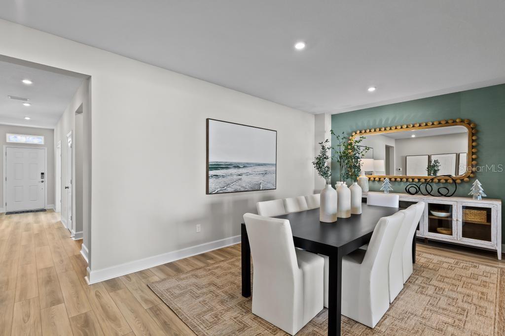 60 Pegasus Road Flagler Beach, FL 32136 - Photo 22 of 51 a dining room with a wooden table and chairs