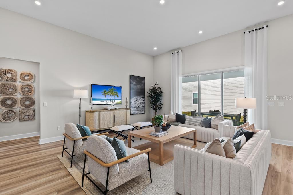 60 Pegasus Road Flagler Beach, FL 32136 - Photo 23 of 51 a living room with furniture and a flat screen tv