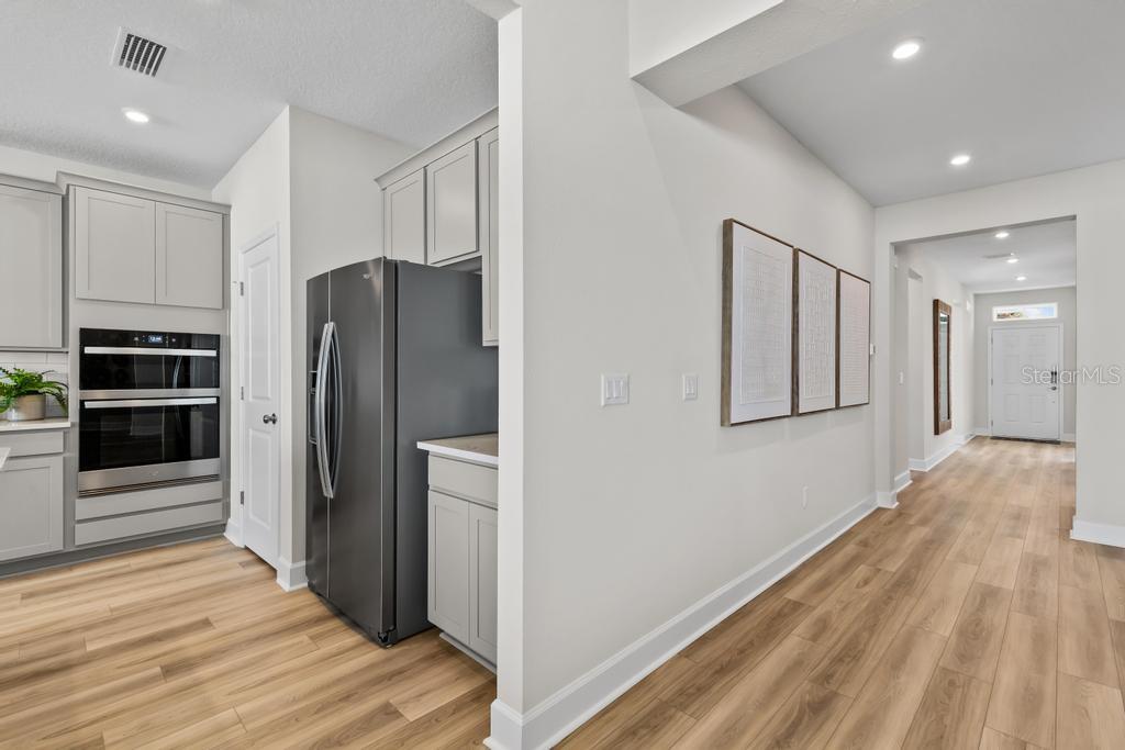 60 Pegasus Road Flagler Beach, FL 32136 - Photo 27 of 51 a view of a kitchen with refrigerator and an oven