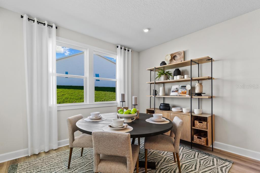 60 Pegasus Road Flagler Beach, FL 32136 - Photo 33 of 51 a view of a dining room with furniture window and wooden floor