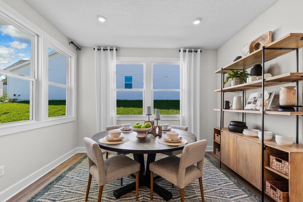 60 Pegasus Road Flagler Beach, FL 32136 - Photo 34 of 51 a view of a dining room with furniture window and wooden floor