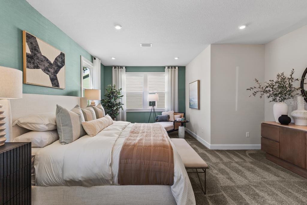 60 Pegasus Road Flagler Beach, FL 32136 - Photo 37 of 51 a bedroom with a large bed and a potted plant