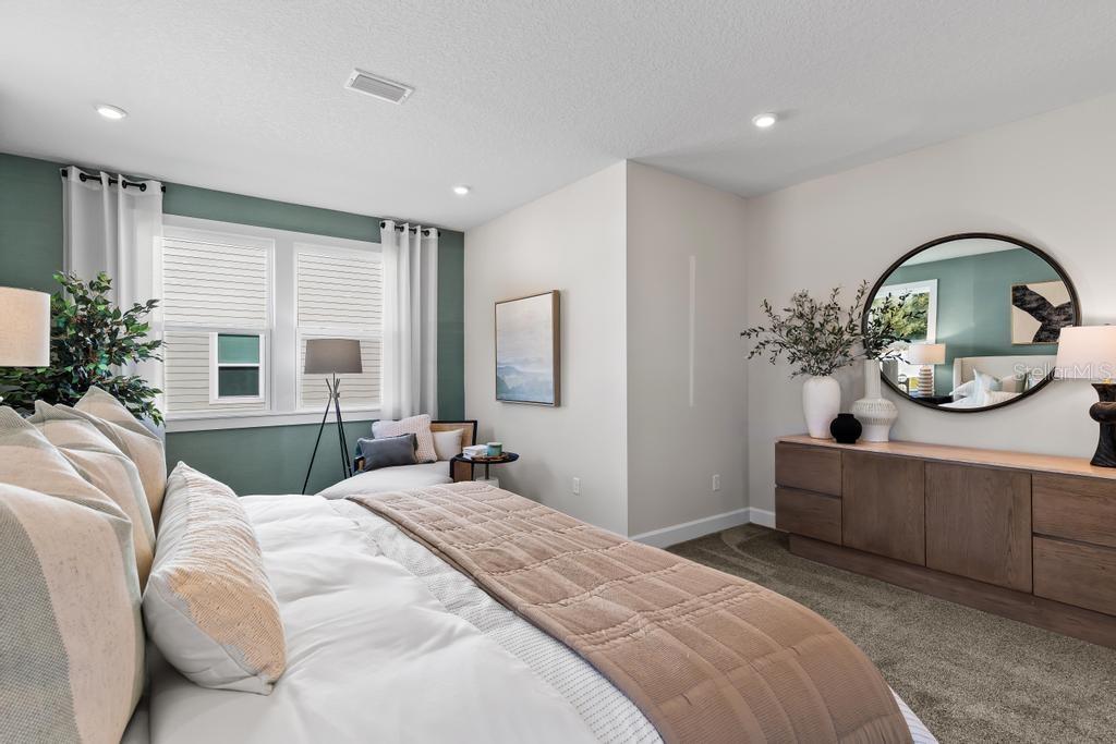 60 Pegasus Road Flagler Beach, FL 32136 - Photo 38 of 51 a bedroom with a bed mirror and window