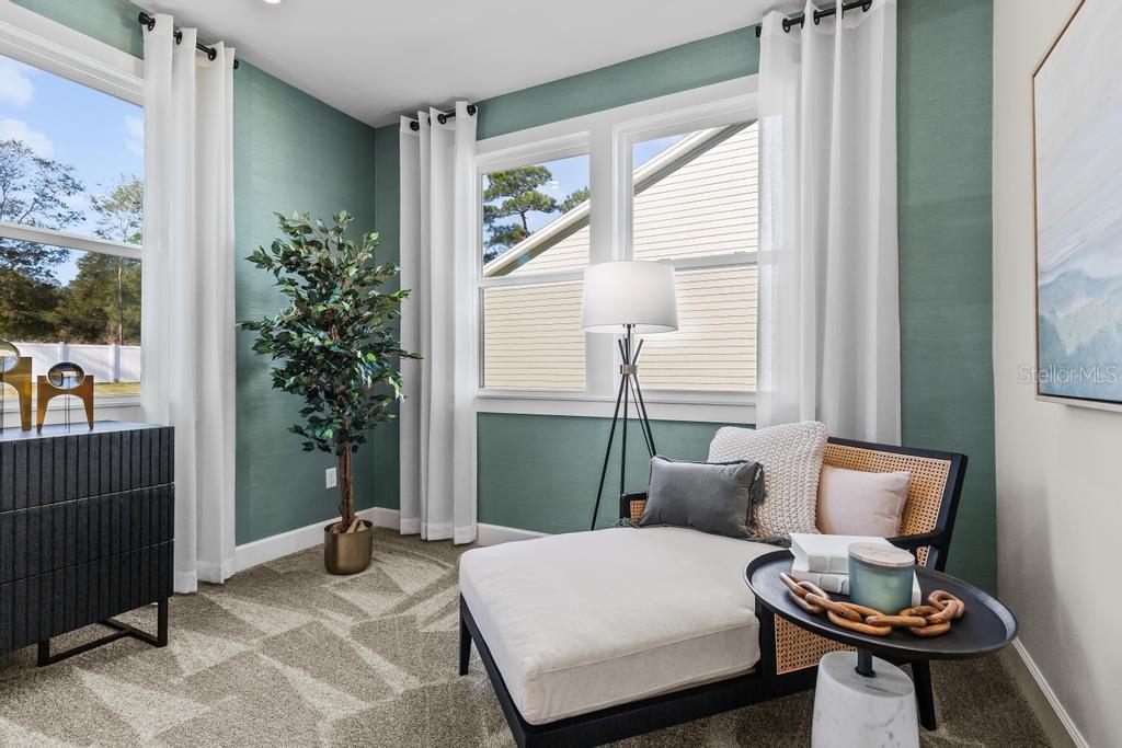 60 Pegasus Road Flagler Beach, FL 32136 - Photo 39 of 51 a bedroom with furniture and a window