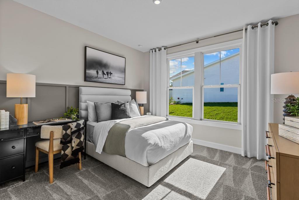 60 Pegasus Road Flagler Beach, FL 32136 - Photo 5 of 51 a bedroom with a bed and a window