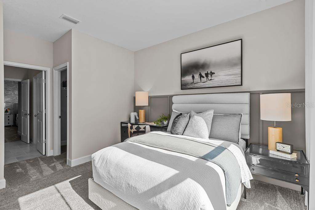 60 Pegasus Road Flagler Beach, FL 32136 - Photo 6 of 51 a bedroom with a bed and lamp