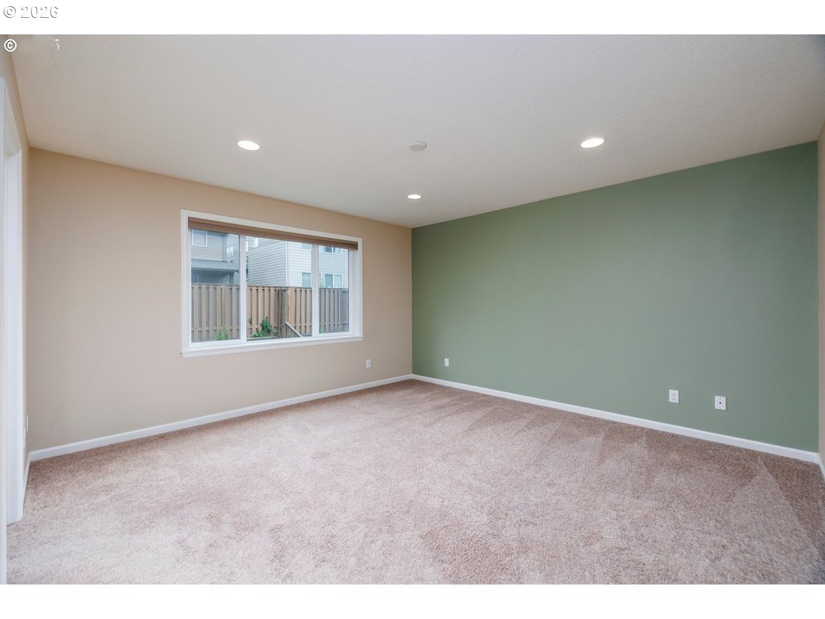15997 Northwest Rossetta Street Portland, OR 97229 - Photo 18 of 36 a view of an empty room with a window