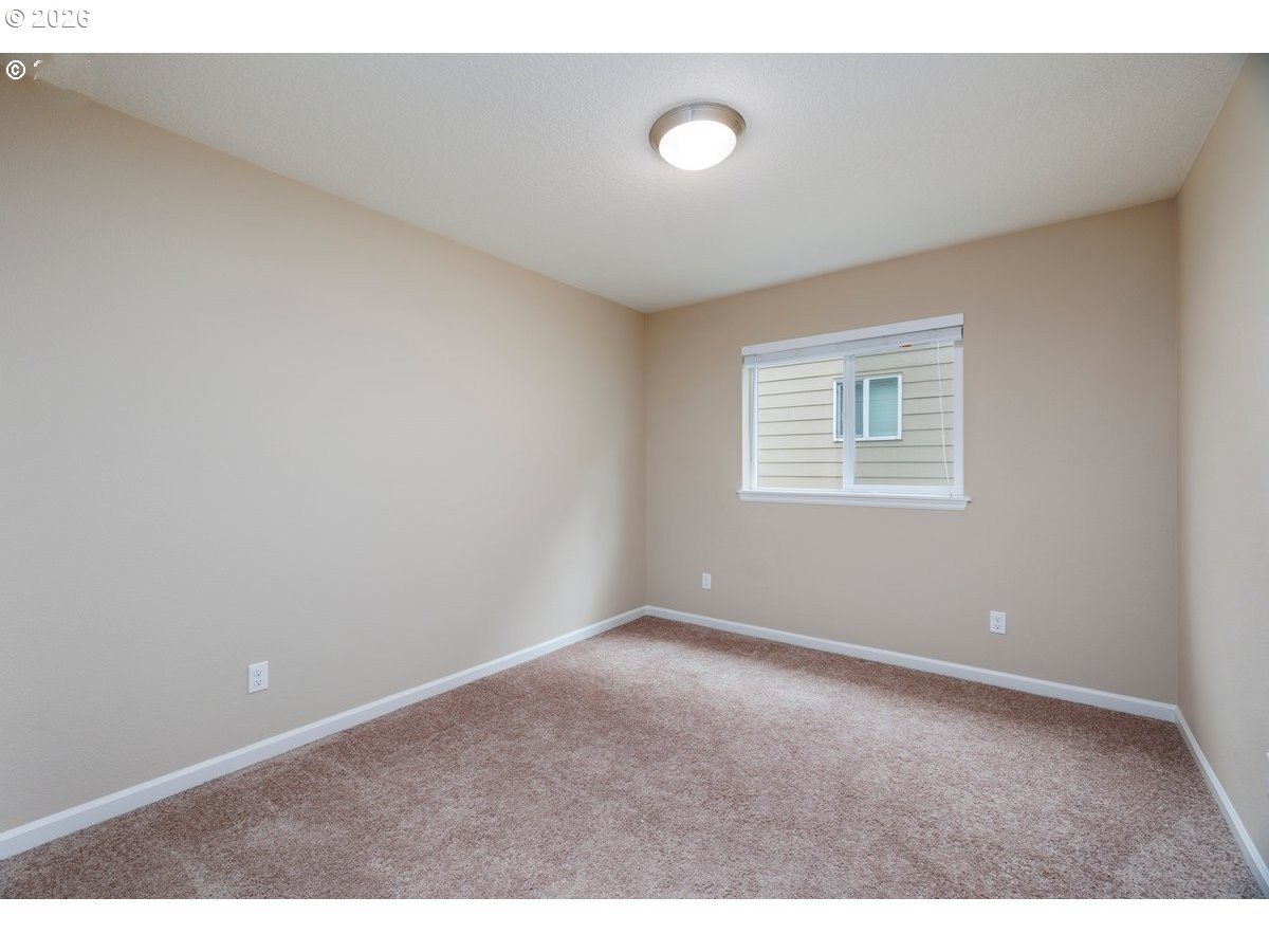 15997 Northwest Rossetta Street Portland, OR 97229 - Photo 24 of 36 a view of an empty room with a window