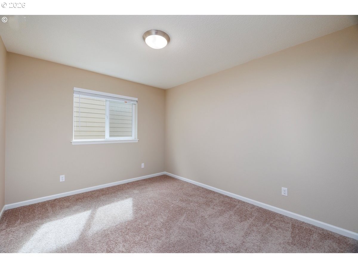 15997 Northwest Rossetta Street Portland, OR 97229 - Photo 26 of 36 an empty room with windows