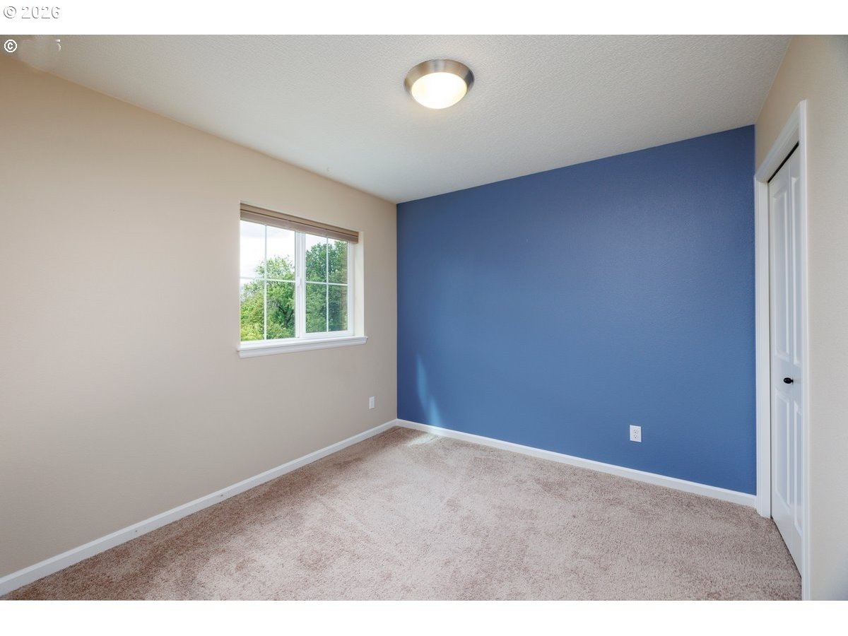 15997 Northwest Rossetta Street Portland, OR 97229 - Photo 29 of 36 an empty room with windows