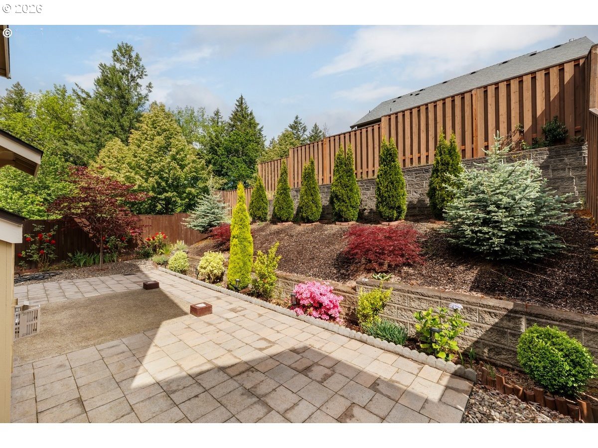 15997 Northwest Rossetta Street Portland, OR 97229 - Photo 33 of 36 a view of a backyard with potted plants