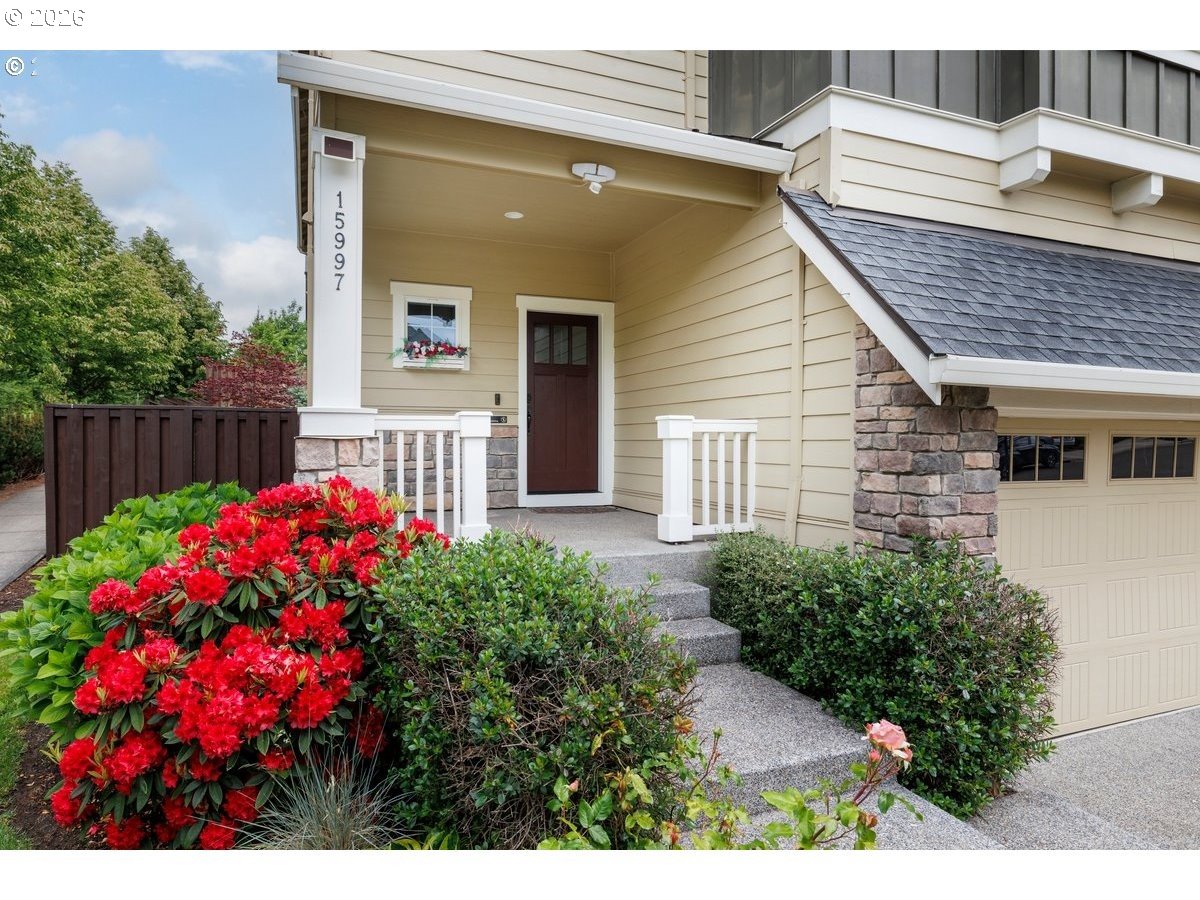 15997 Northwest Rossetta Street Portland, OR 97229 - Photo 6 of 36 a view of a house with a flower garden