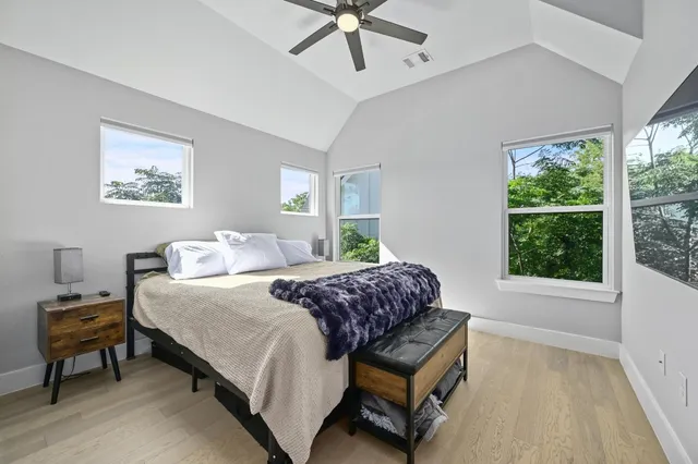 a bedroom with a bed and a window