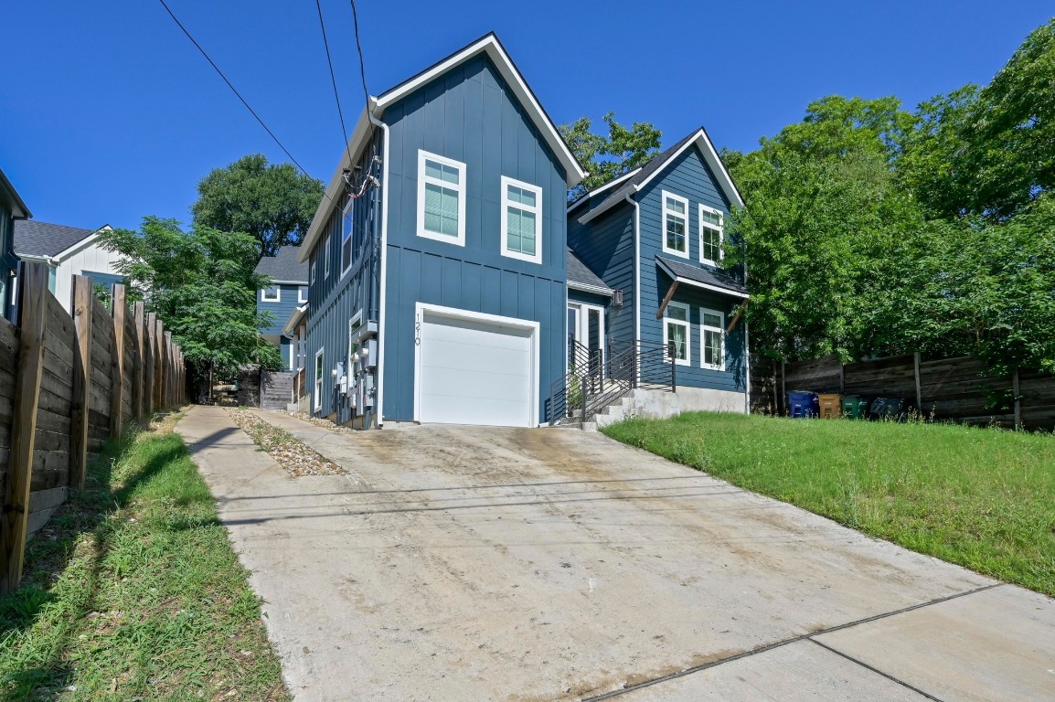 1210 Luna Street, Unit 2 Austin, TX 78721 - Photo 7 of 28 a front view of a house with a yard