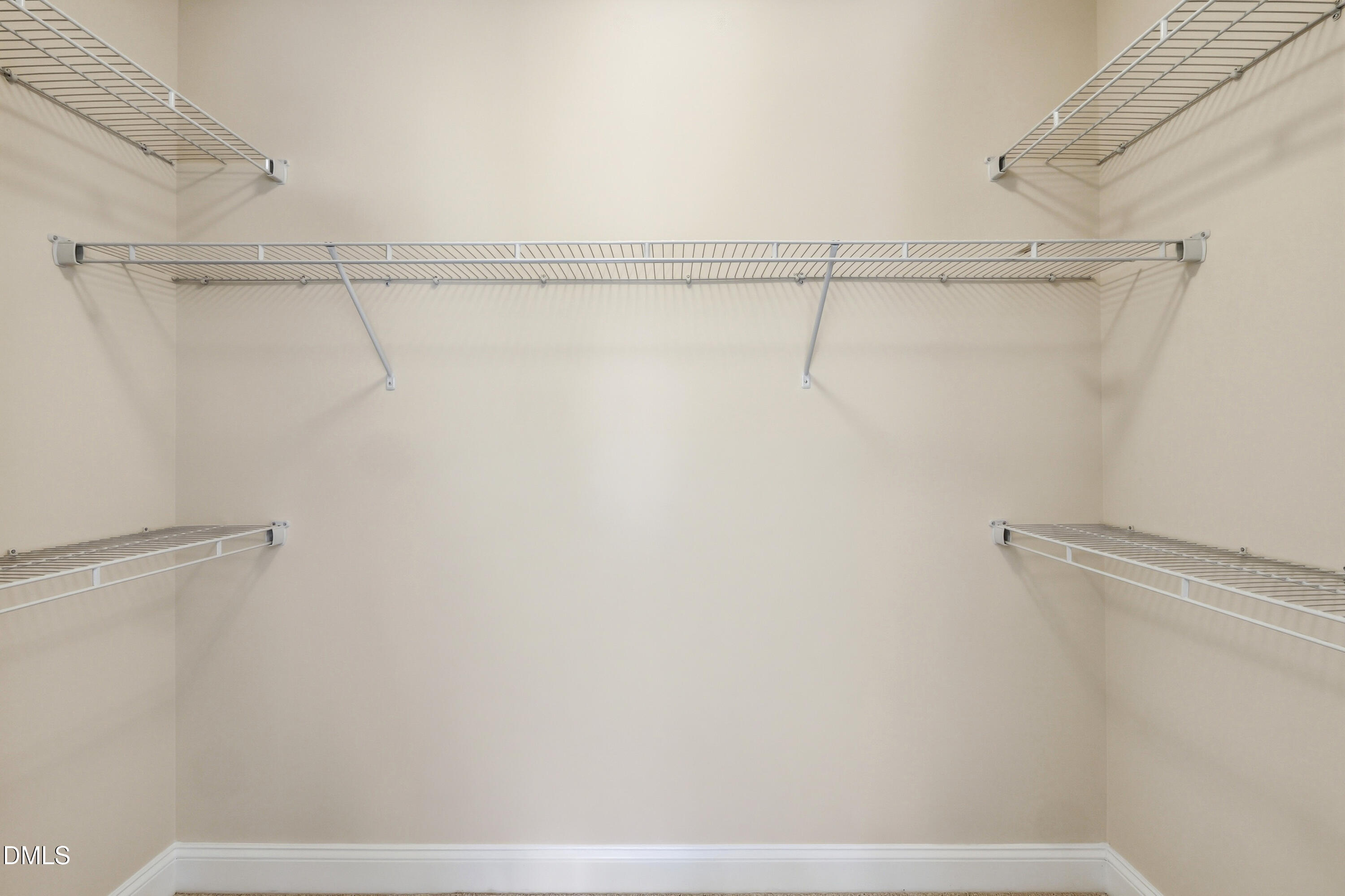 1004 Waymaker Court Apex, NC 27502 - Photo 18 of 30 a view of a room with racks on the wall
