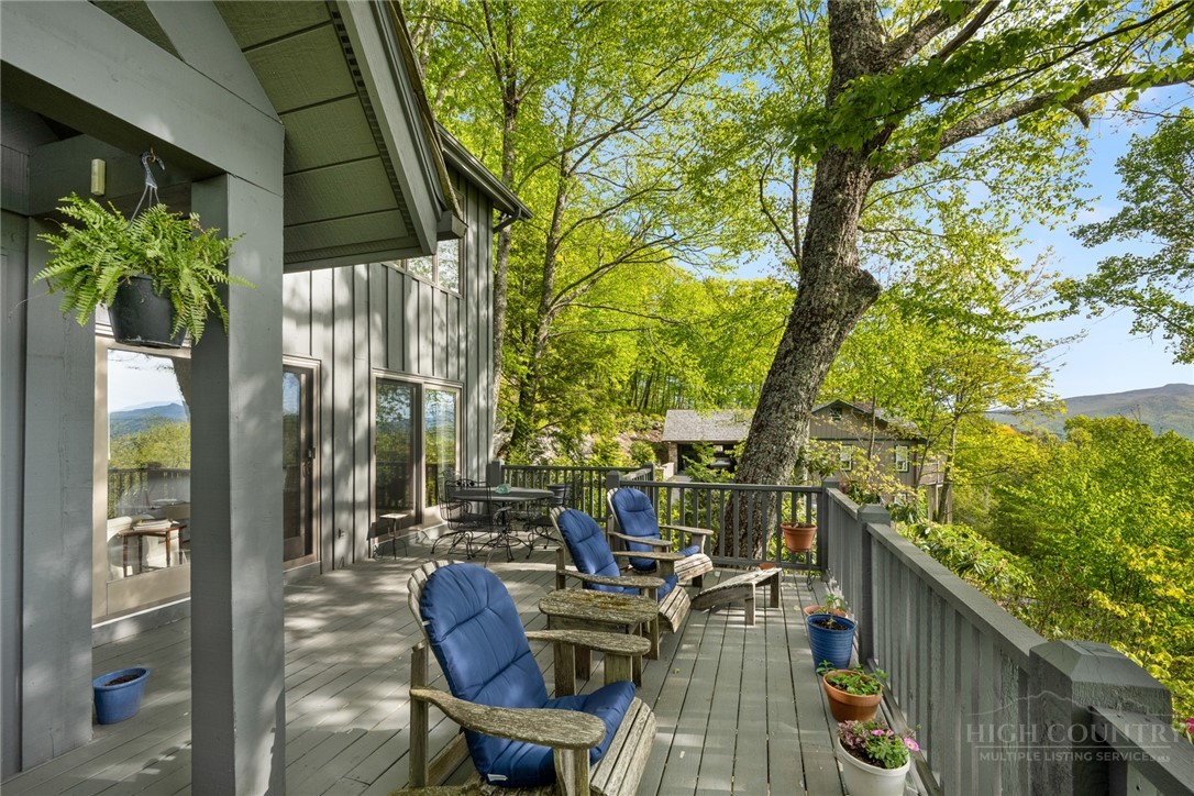 246 Mulberry Lane Boone, NC 28607 - Photo 13 of 49 a view of balcony with chairs and potted plants