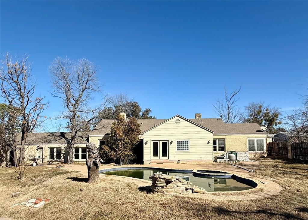 720 East Leslie Street Hamilton, TX 76531 - Photo 21 of 31 a front view of a house with a yard