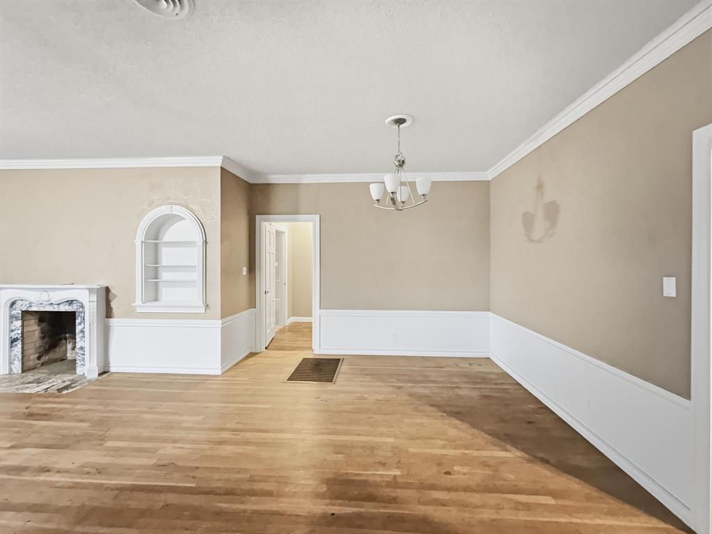 720 East Leslie Street Hamilton, TX 76531 - Photo 6 of 31 a view of empty room with a fireplace