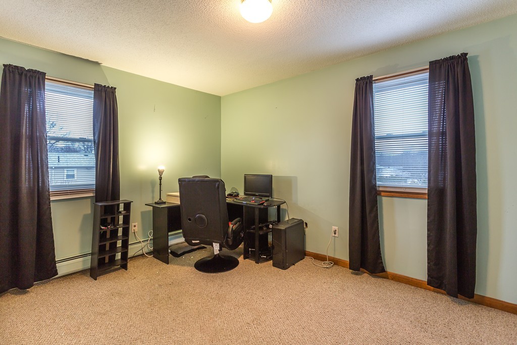 137 Riley Avenue Somerset, MA 02726 - Photo 25 of 30 a view of a workspace with furniture and a window