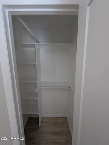 a view of an empty walk in closet