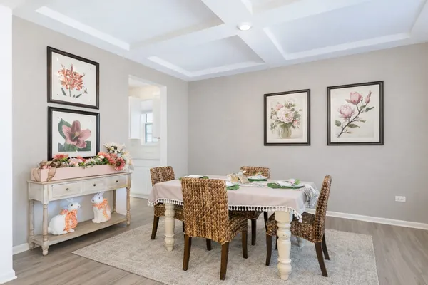 a view of a dining room with furniture and a kitchen