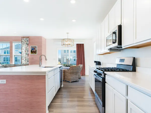 a kitchen with stainless steel appliances granite countertop a stove and a sink