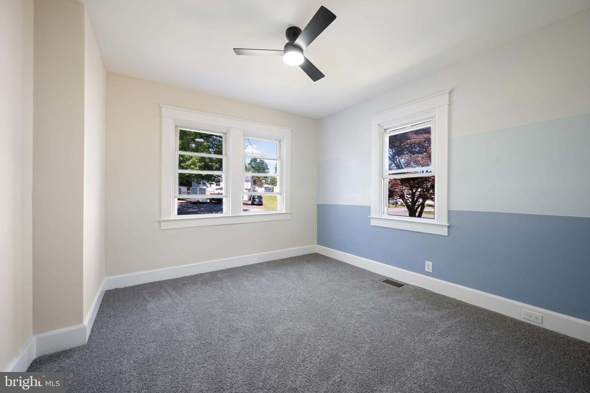517 Valcour Road Baltimore, MD 21228 - Photo 22 of 47 a view of empty room with windows