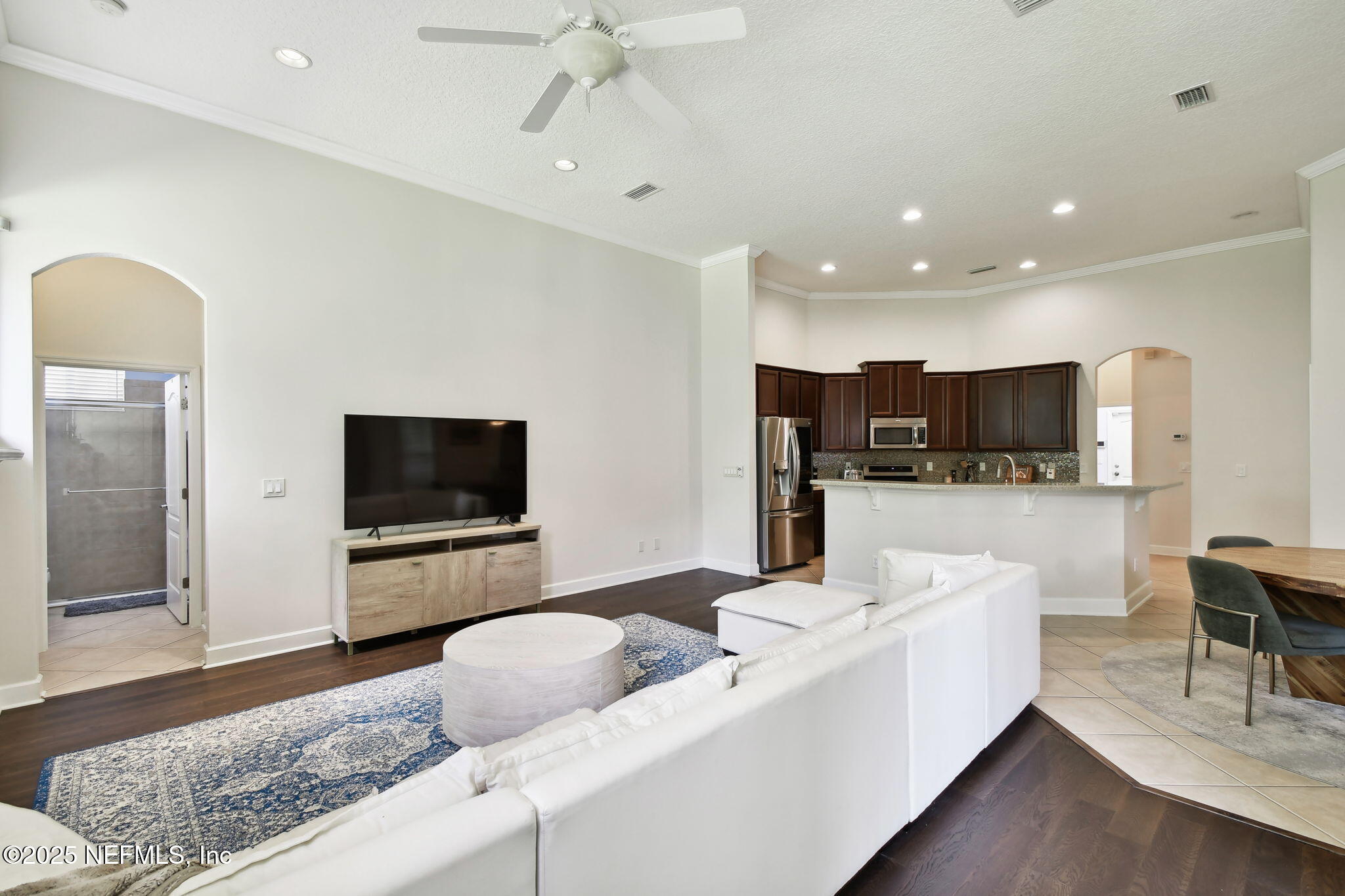 6003 Shadehill Road Jacksonville, FL 32258 - Photo 15 of 46 a living room with furniture and a flat screen tv