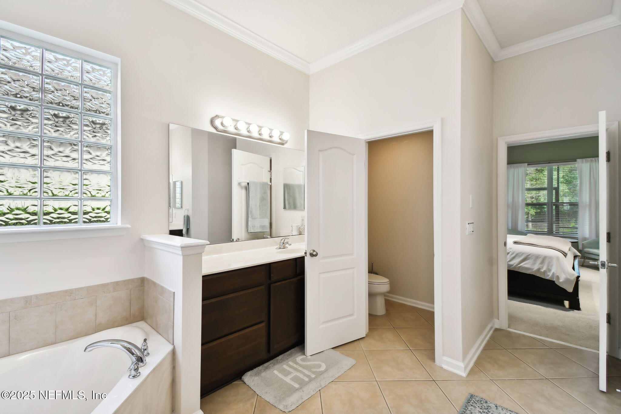 6003 Shadehill Road Jacksonville, FL 32258 - Photo 19 of 46 a en suite bathroom with a tub sink and a mirror