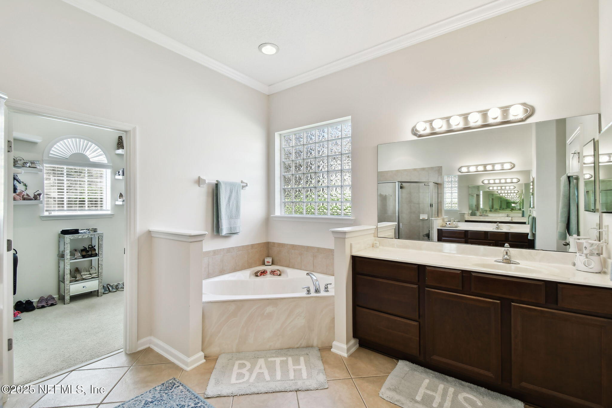 6003 Shadehill Road Jacksonville, FL 32258 - Photo 20 of 46 a bathroom with a double vanity sink mirror and bathtub