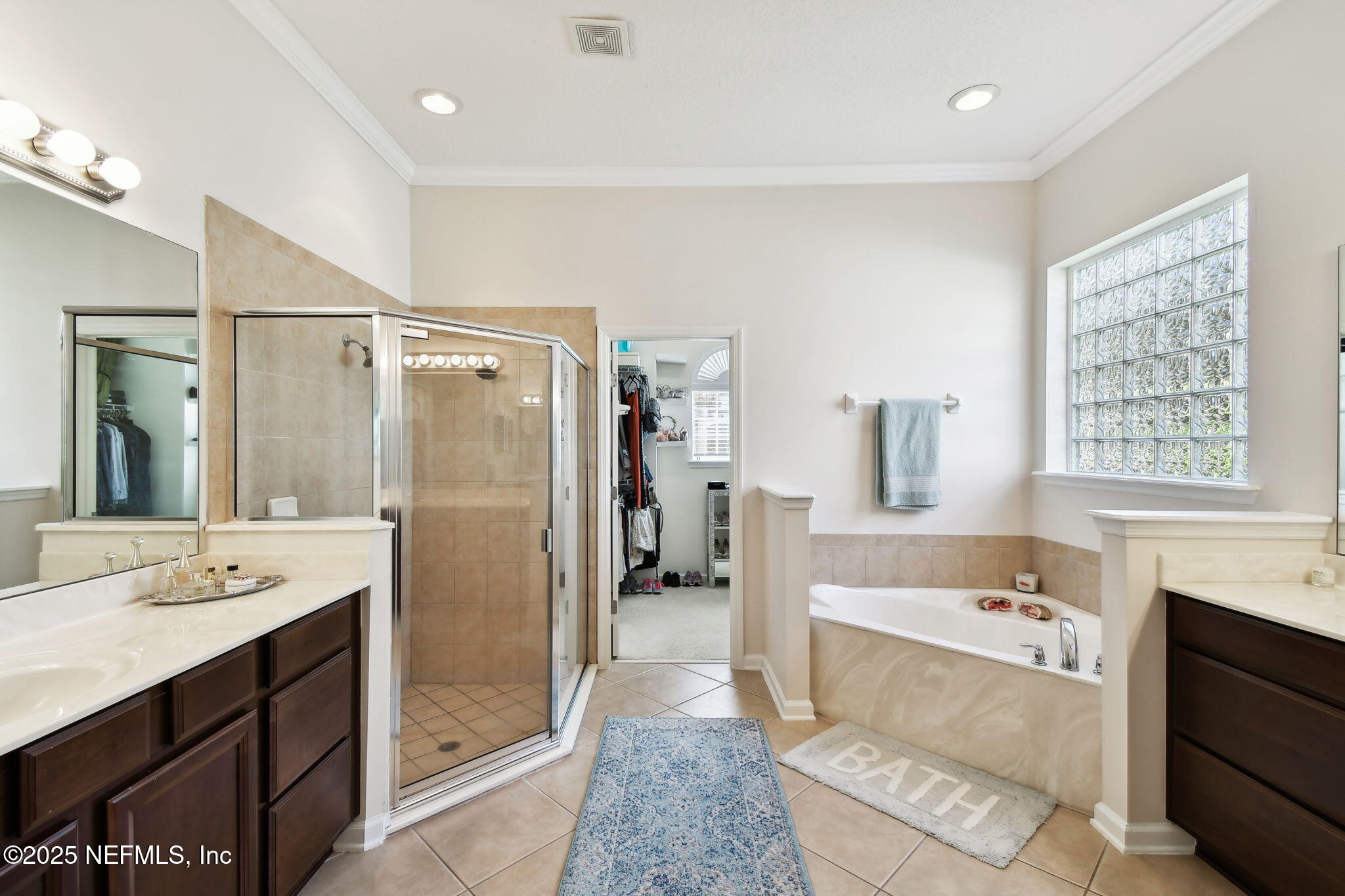 6003 Shadehill Road Jacksonville, FL 32258 - Photo 22 of 46 a bathroom with a tub a sink shower and a mirror