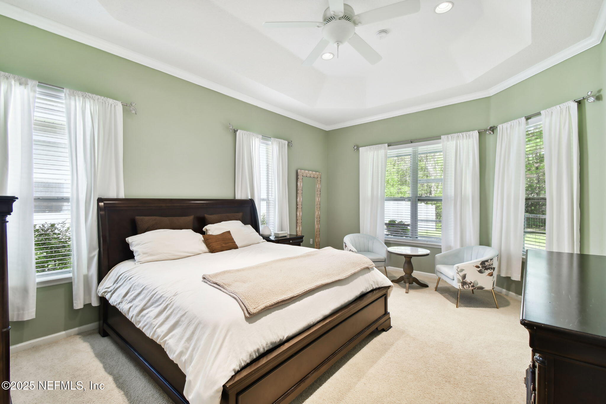 6003 Shadehill Road Jacksonville, FL 32258 - Photo 25 of 46 a bedroom with a large bed and a large window