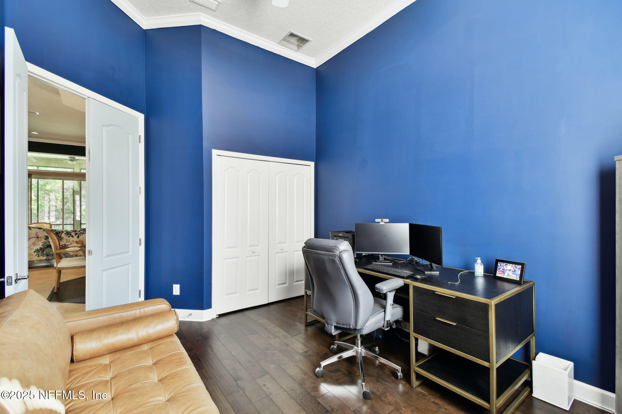 6003 Shadehill Road Jacksonville, FL 32258 - Photo 27 of 46 a view of a workspace with furniture and wooden floor