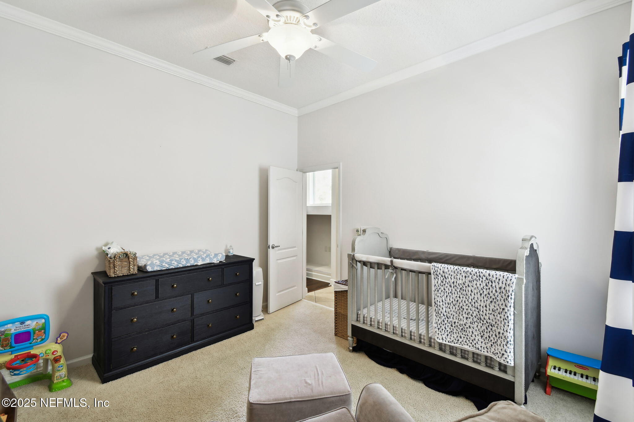 6003 Shadehill Road Jacksonville, FL 32258 - Photo 30 of 46 a bedroom with a bed and wooden floor