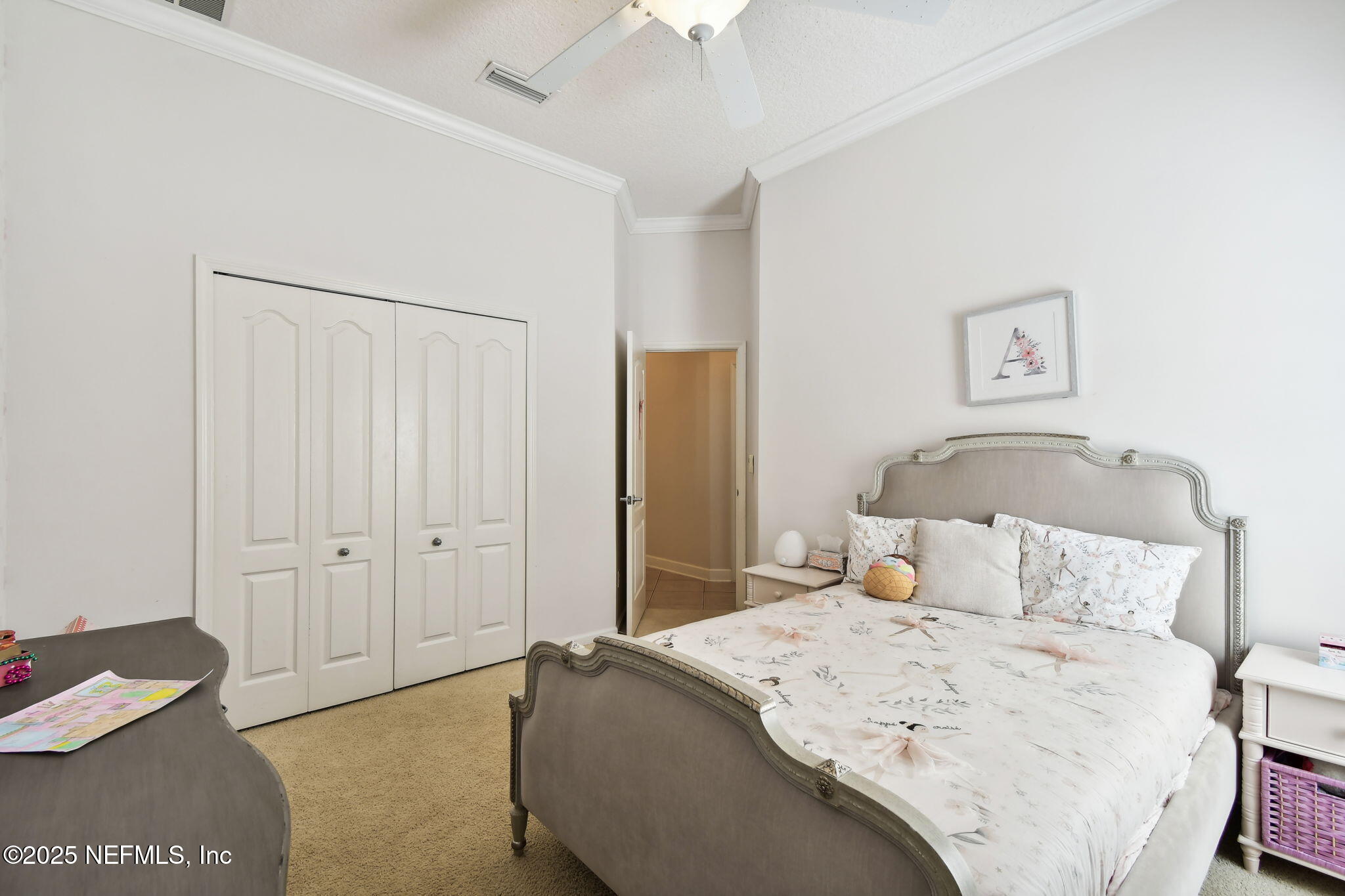 6003 Shadehill Road Jacksonville, FL 32258 - Photo 31 of 46 a bedroom with a bed and a chandelier