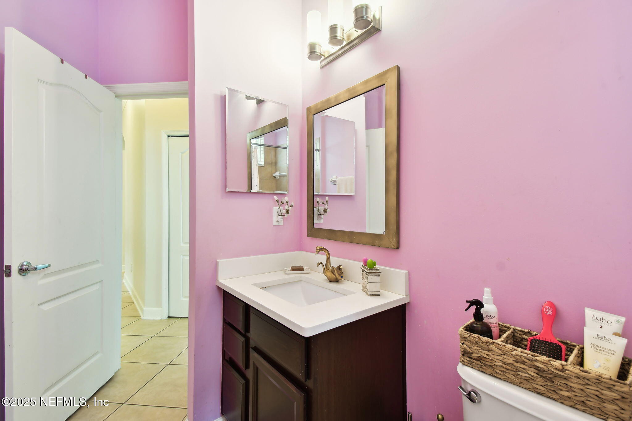 6003 Shadehill Road Jacksonville, FL 32258 - Photo 33 of 46 a bathroom with a sink and a mirror
