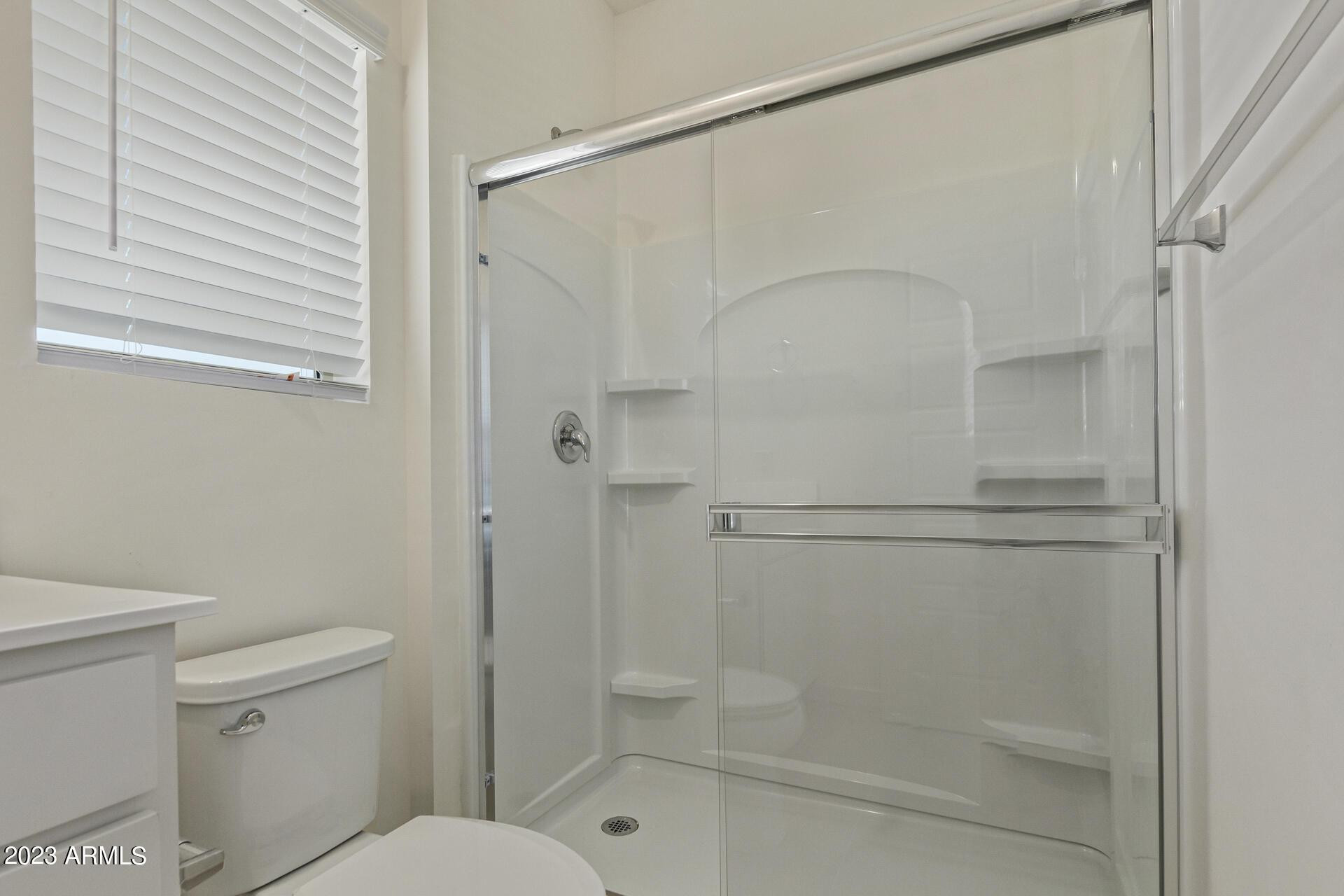2280 West Laurie Lane Phoenix, AZ 85021 - Photo 13 of 27 a bathroom with a shower a toilet and a shower