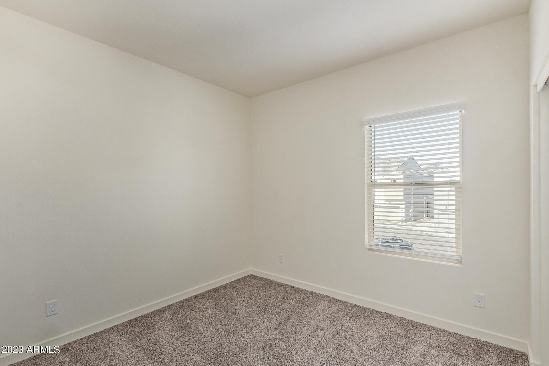 2280 West Laurie Lane Phoenix, AZ 85021 - Photo 16 of 27 an empty room with a window