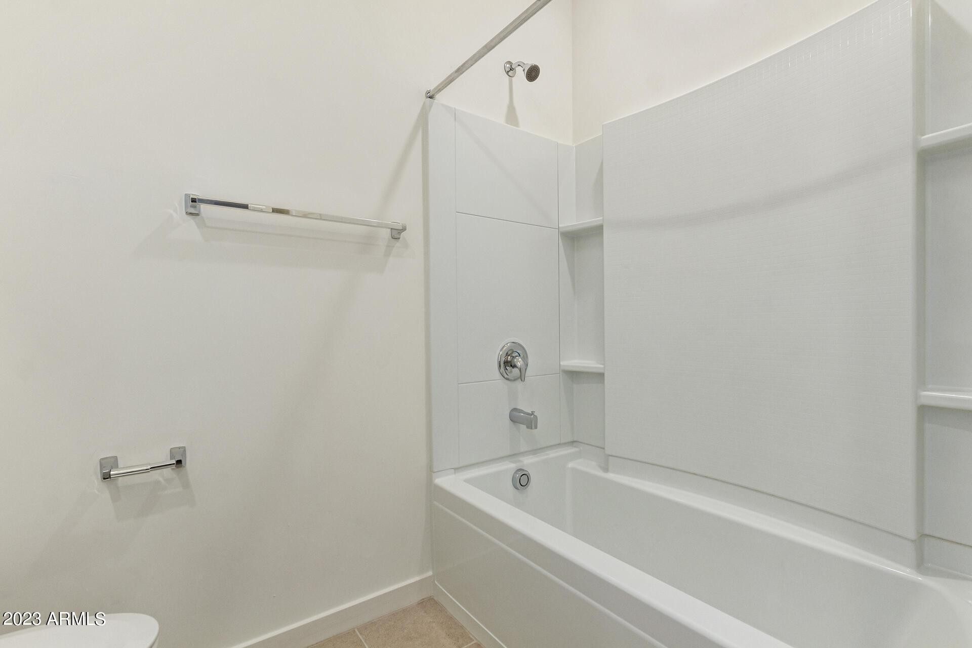 2280 West Laurie Lane Phoenix, AZ 85021 - Photo 19 of 27 a bathroom with a tub and shower